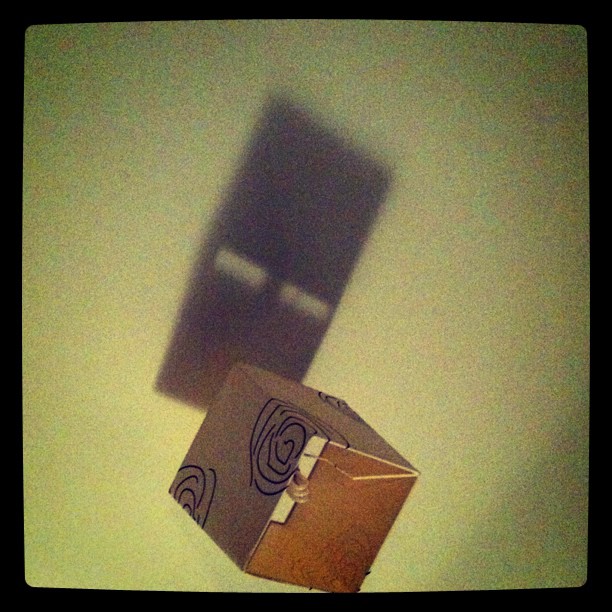 Shadow of a lampshade which looks like the face of an enderman from minecraft