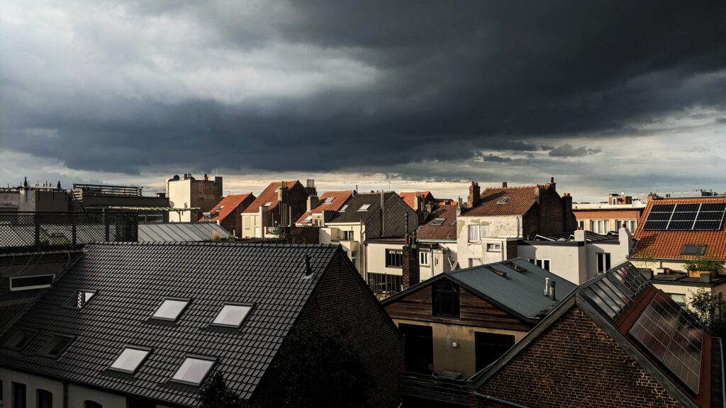 Dramatic clouds over Belgian rooftops